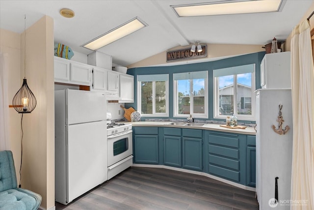 kitchen featuring dark wood-style floors, white appliances, a sink, and lofted ceiling with beams