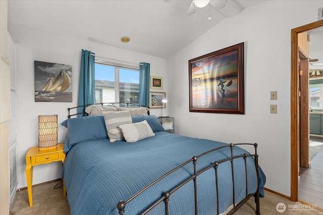 carpeted bedroom with baseboards, vaulted ceiling, and a ceiling fan