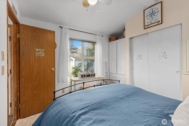 bedroom featuring ceiling fan and vaulted ceiling