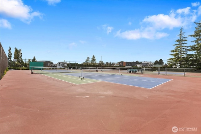 view of sport court with fence