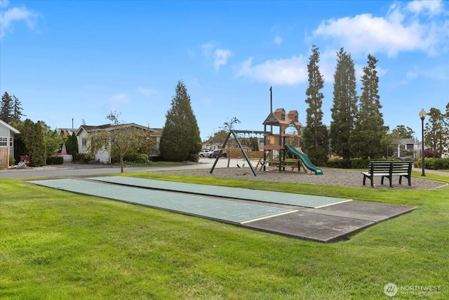 communal playground featuring shuffleboard and a yard