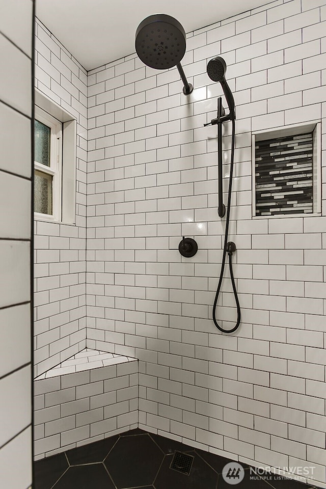 bathroom featuring a tile shower