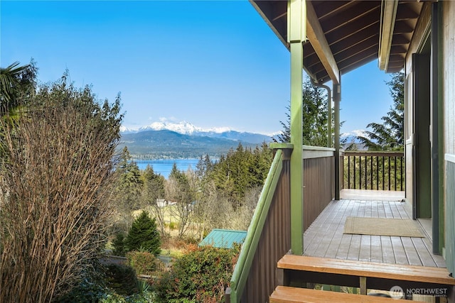 balcony with a water and mountain view