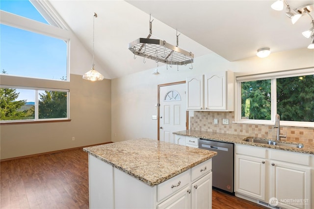 kitchen with a sink, dark wood-style floors, white cabinets, decorative backsplash, and dishwasher