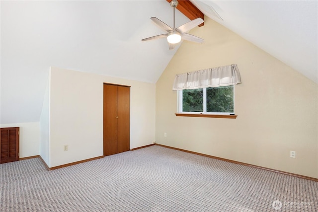 additional living space featuring vaulted ceiling with beams, visible vents, light carpet, ceiling fan, and baseboards