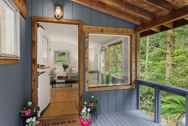 sunroom / solarium with lofted ceiling