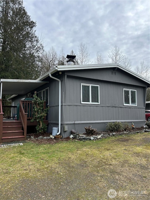 view of home's exterior featuring a yard and a chimney