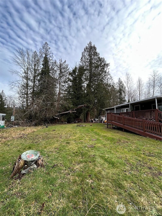 view of yard featuring a wooden deck