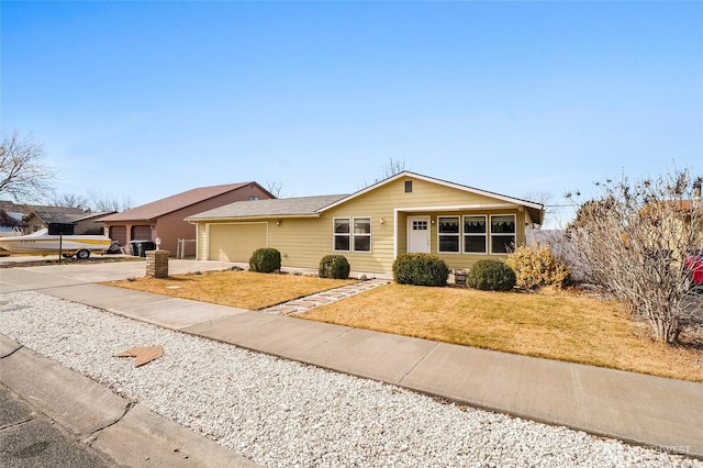 single story home with driveway, a front lawn, and an attached garage