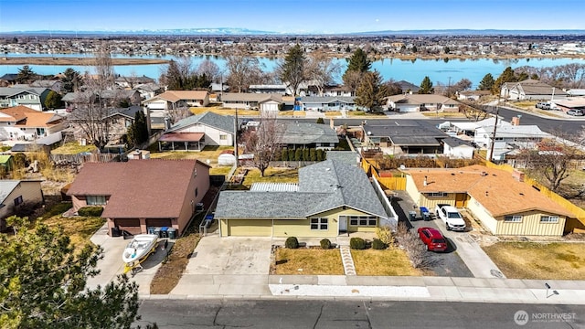 aerial view featuring a water view and a residential view