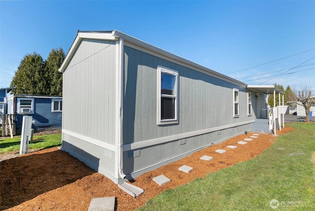 view of side of home featuring crawl space, a lawn, and cooling unit