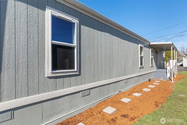 view of side of property featuring crawl space