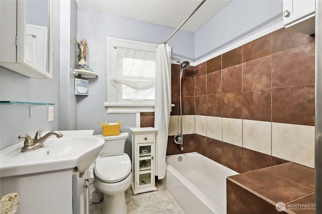 full bath featuring vanity, tile patterned flooring, toilet, and shower / tub combo with curtain