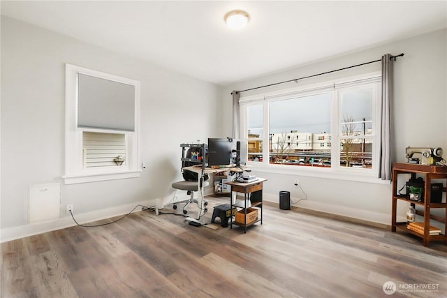 office featuring baseboards and wood finished floors