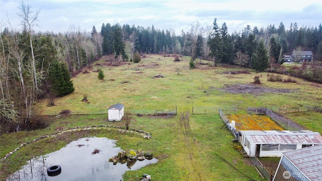 aerial view featuring a wooded view