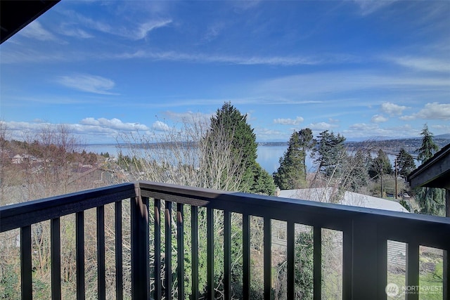 balcony featuring a water view