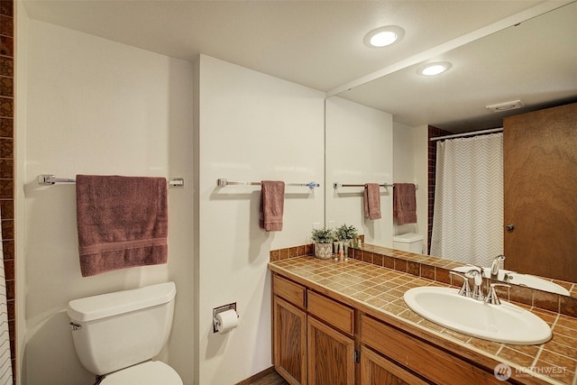 bathroom with recessed lighting, visible vents, a shower with shower curtain, toilet, and vanity