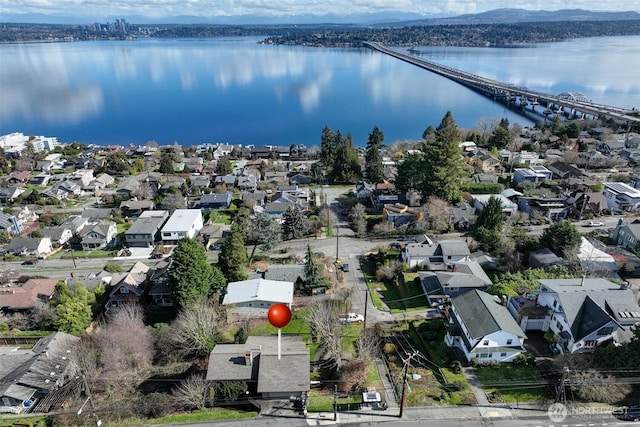 birds eye view of property featuring a water view and a residential view