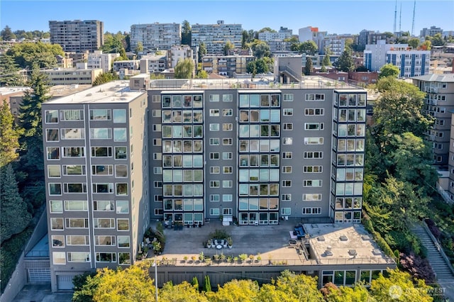 birds eye view of property featuring a city view