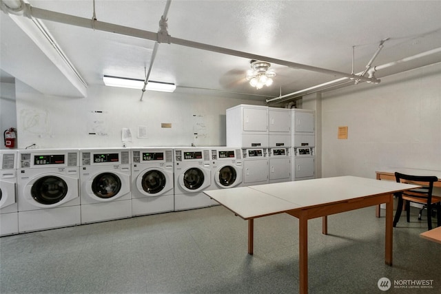 shared laundry area with tile patterned floors, ceiling fan, washing machine and clothes dryer, and stacked washer and clothes dryer