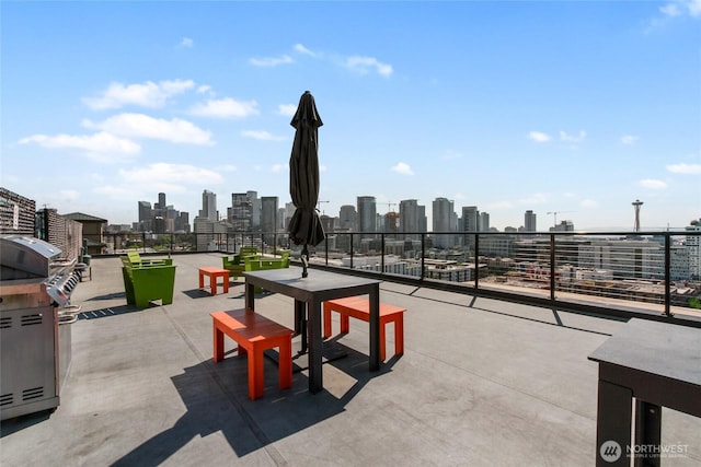 view of patio / terrace featuring a city view