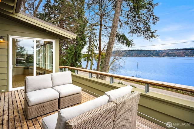 wooden terrace with a water view