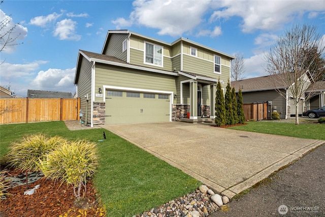 view of front of property with concrete driveway, an attached garage, a front yard, fence, and stone siding