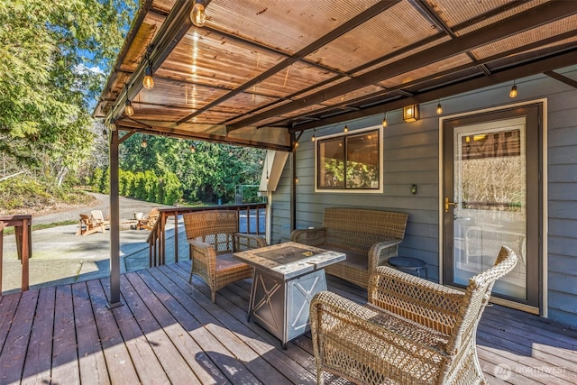 wooden deck with a fire pit