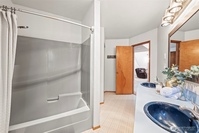 full bath featuring shower / tub combo, a sink, and tile patterned floors