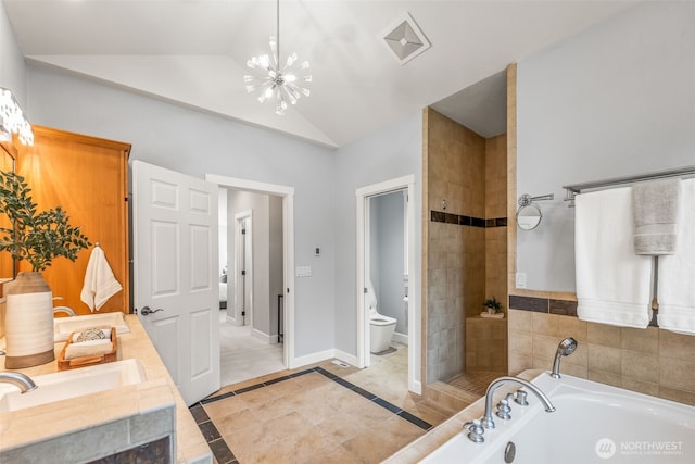 bathroom with a bath, baseboards, an inviting chandelier, vaulted ceiling, and toilet