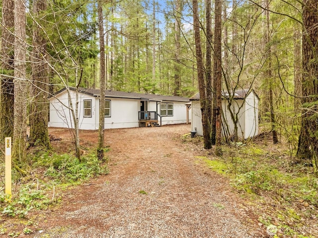 view of front of home with an outdoor structure