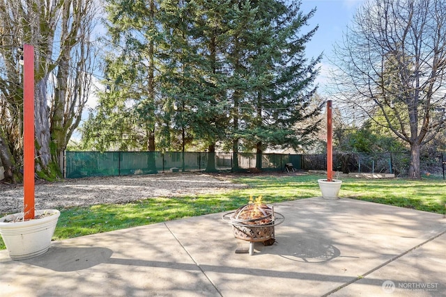 view of patio featuring a fire pit and a fenced backyard