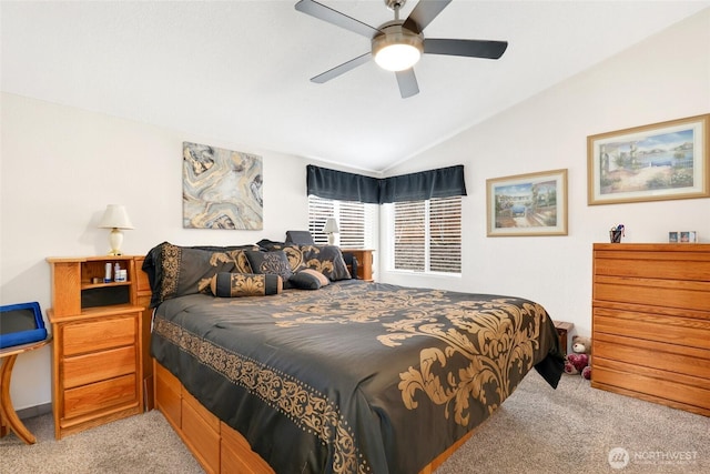 carpeted bedroom featuring ceiling fan and lofted ceiling