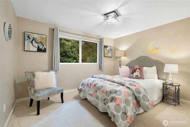 bedroom with carpet flooring and baseboards