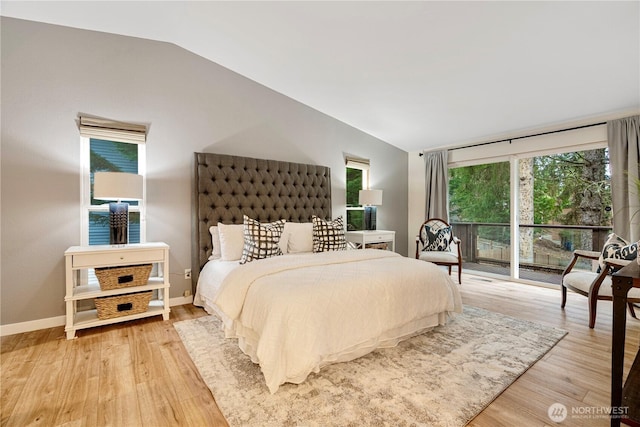 bedroom with vaulted ceiling, access to outside, light wood-style flooring, and baseboards