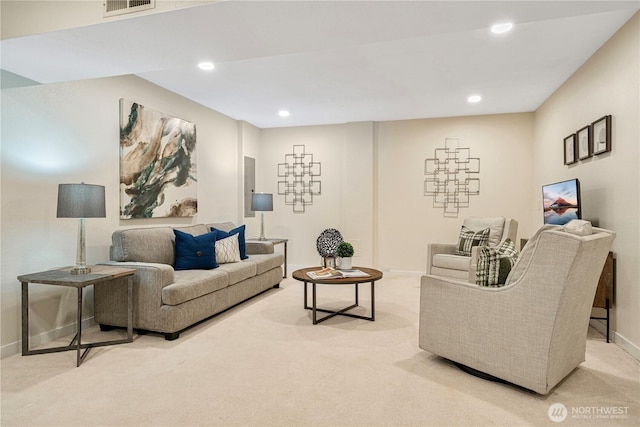 carpeted living room with recessed lighting, visible vents, and baseboards