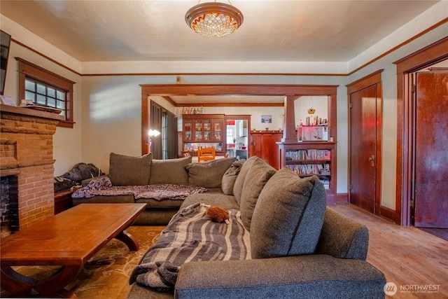 living area featuring a fireplace and wood finished floors