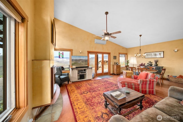 74 Sawtooth View Rd, Pateros, WA 98846 - living room with french doors, ceiling fan with notable chandelier, lofted ceiling, and an AC wall unit