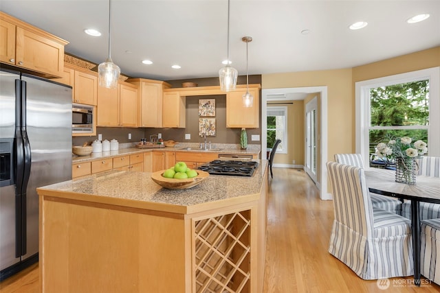 kitchen with light wood-style flooring, light brown cabinets, a sink, recessed lighting, and stainless steel appliances