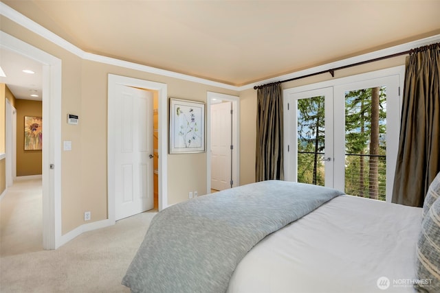 bedroom featuring light carpet, french doors, baseboards, and access to outside