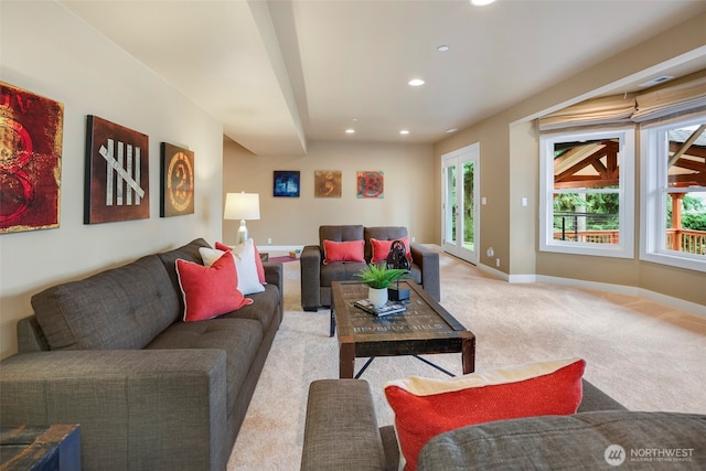 living area with recessed lighting, baseboards, and carpet floors