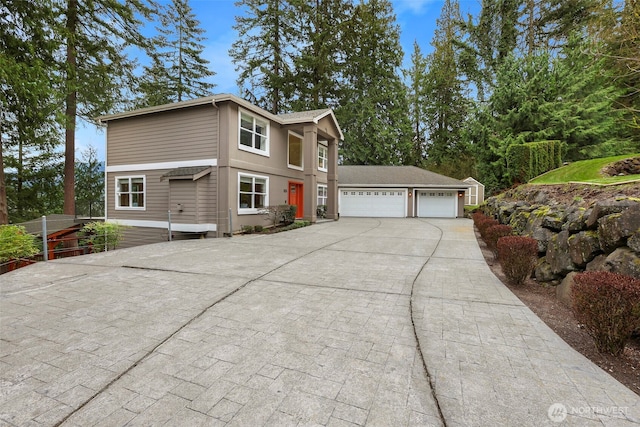 view of front of house featuring an attached garage and concrete driveway