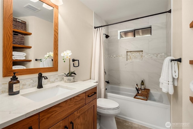 full bathroom with vanity, shower / bath combination with curtain, toilet, and visible vents