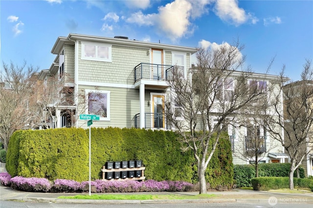 view of front of house featuring a balcony