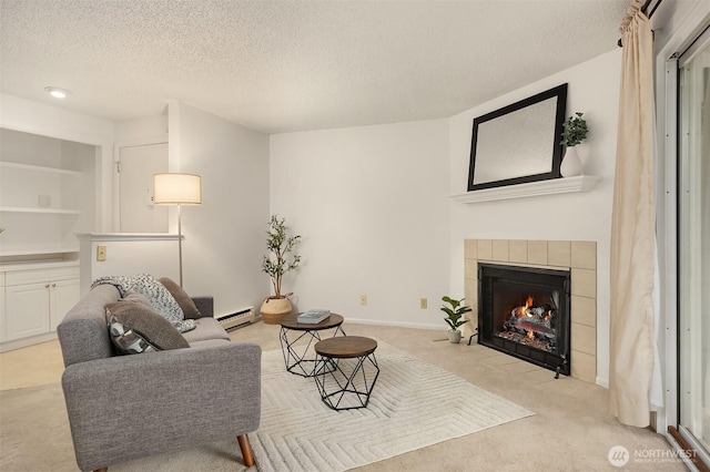 living area featuring a textured ceiling, light carpet, baseboards, baseboard heating, and a tiled fireplace