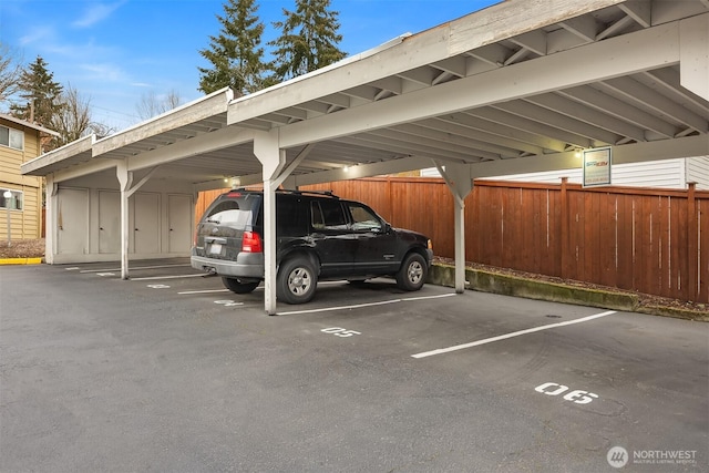 covered parking lot with fence