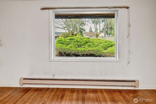 interior details with a baseboard heating unit