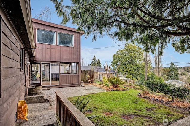 view of yard with a patio and fence