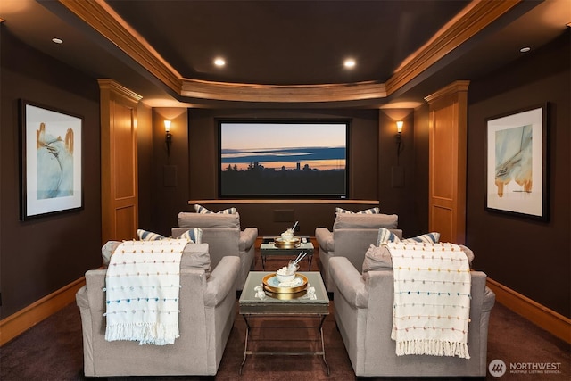 home theater room featuring recessed lighting, a raised ceiling, baseboards, and ornamental molding