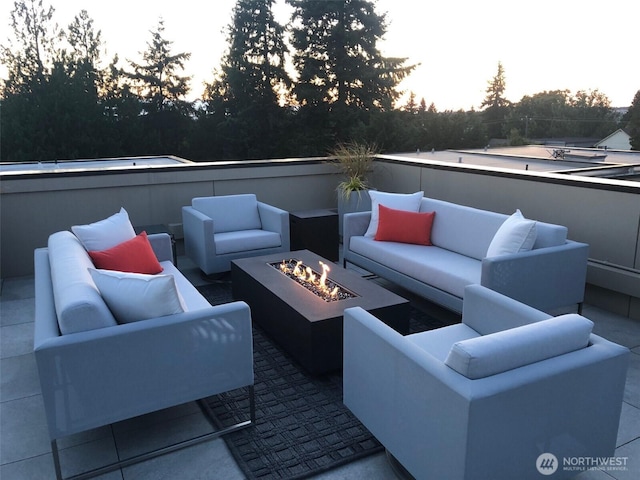 view of patio / terrace featuring an outdoor living space with a fire pit